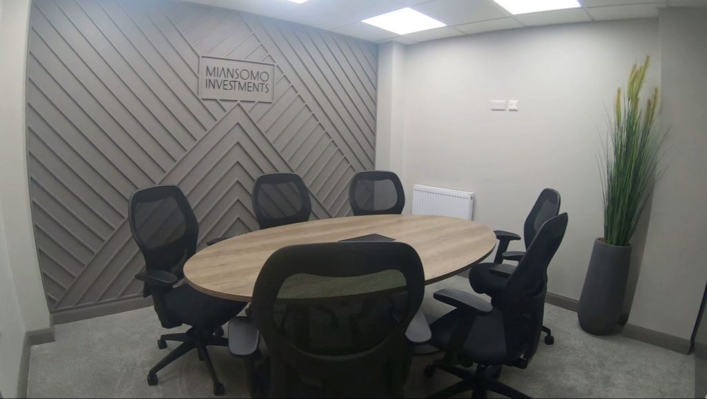 Showcasing Boardroom Table in Nebraska Oak, Alto Office Chairs, Office Plants & Wall Art